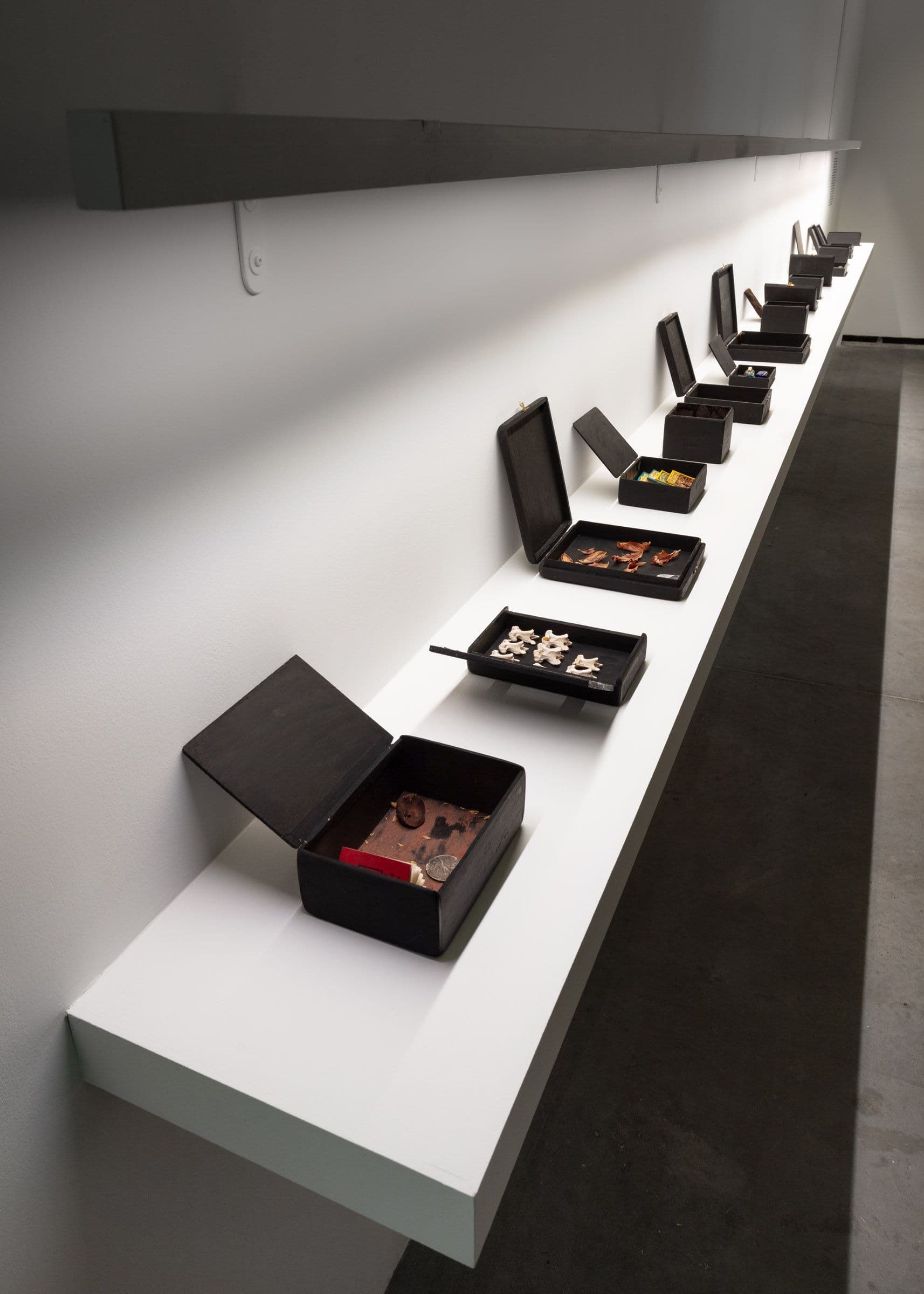 June Clark, Family Secrets, 1992. 18 cigar boxes and mixed media. Courtesy the artist and Daniel Faria Gallery. Installation view: Witness, The Power Plant Contemporary Art Gallery, Toronto, 2024. Photo: LF Documentation.
