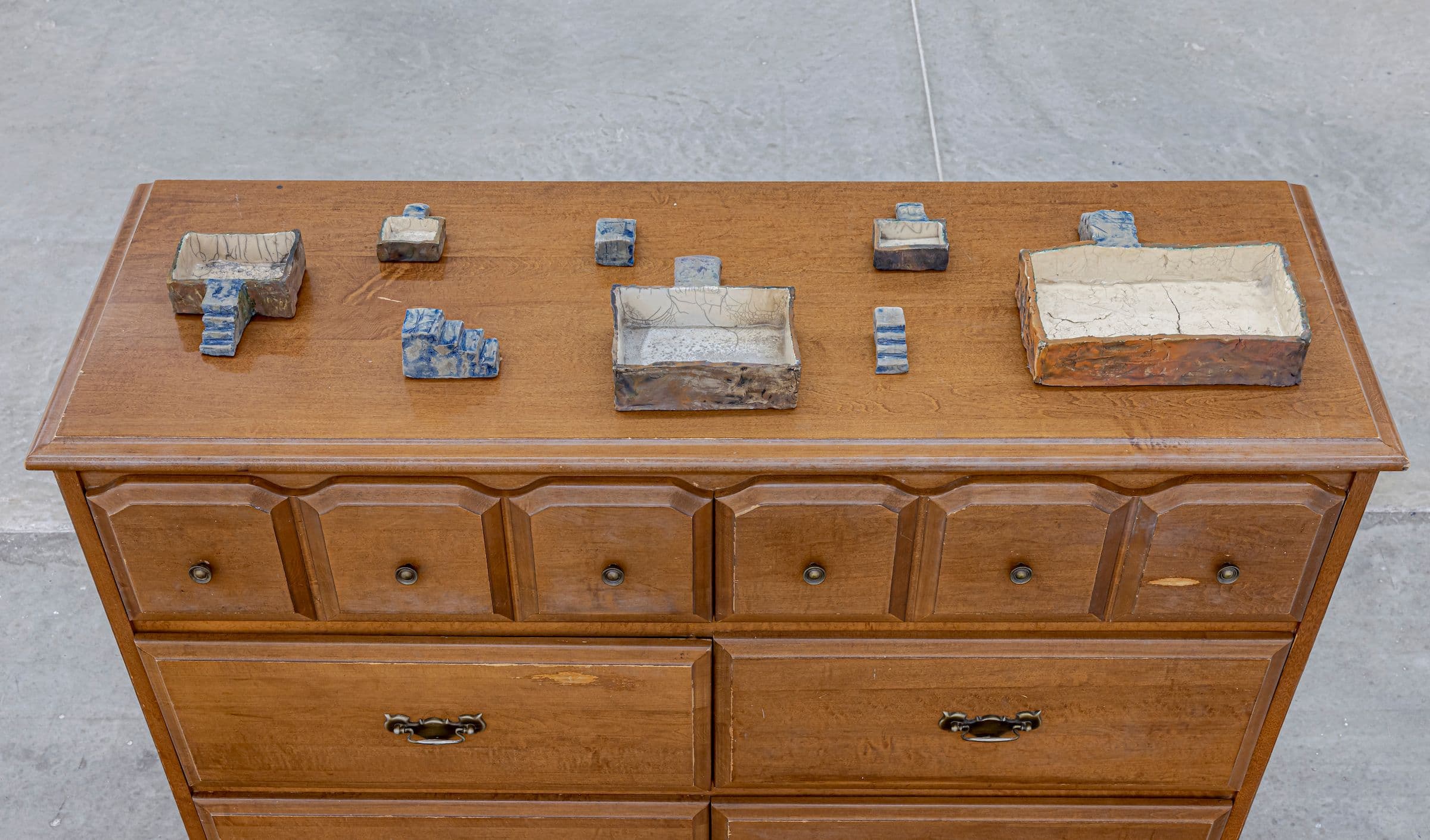 Brenda Draney, Parish 1-8, 2010. Raku-fired clay. Courtesy the artist and Catriona Jeffries, Vancouver. Installation view: The Power Plant, Toronto, 2023. Photo: Toni Hafkenscheid.